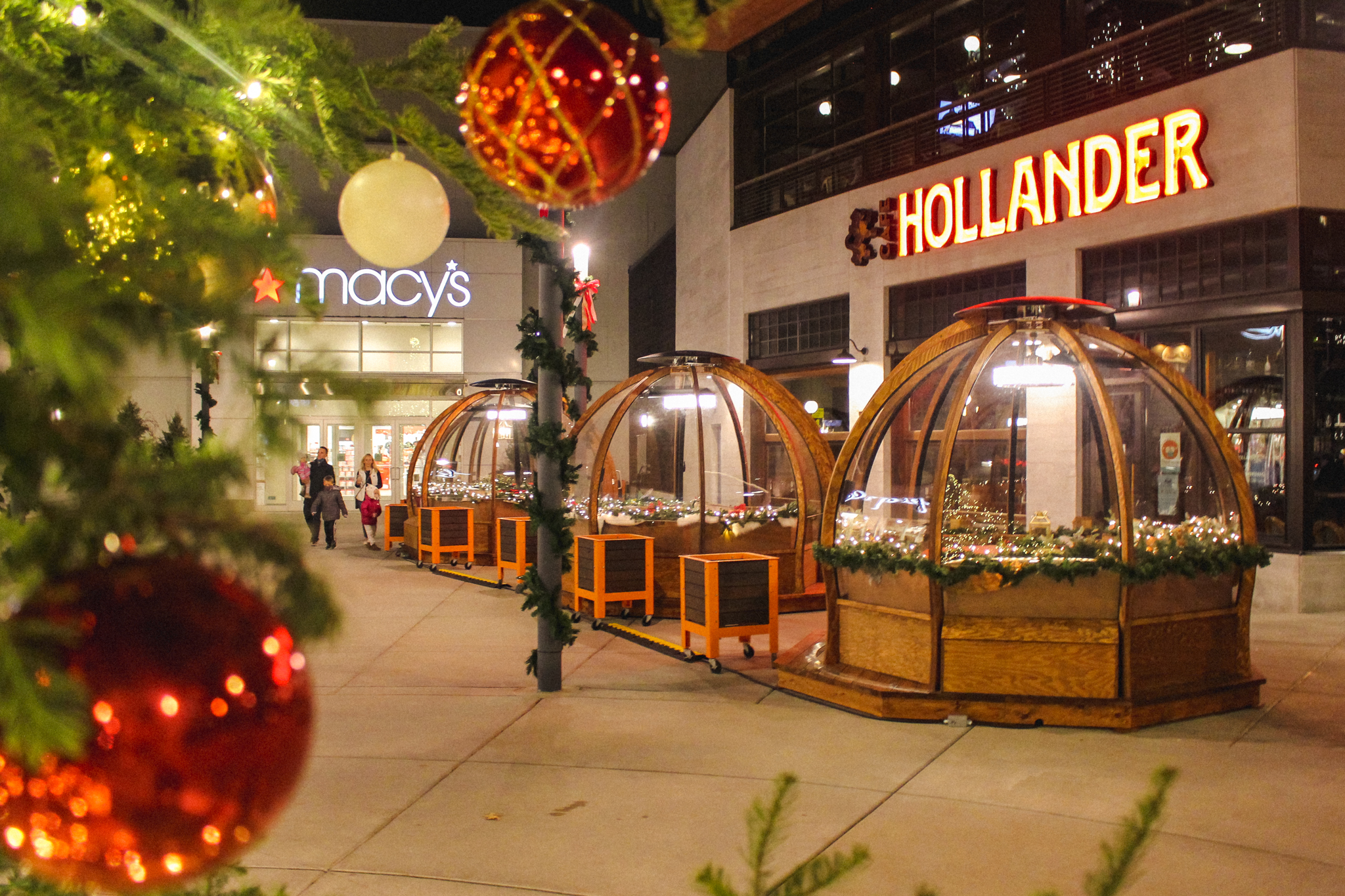 Outdoor dining domes decked out for the holidays outside of Café Hollander in Hilldale Shopping Mall
