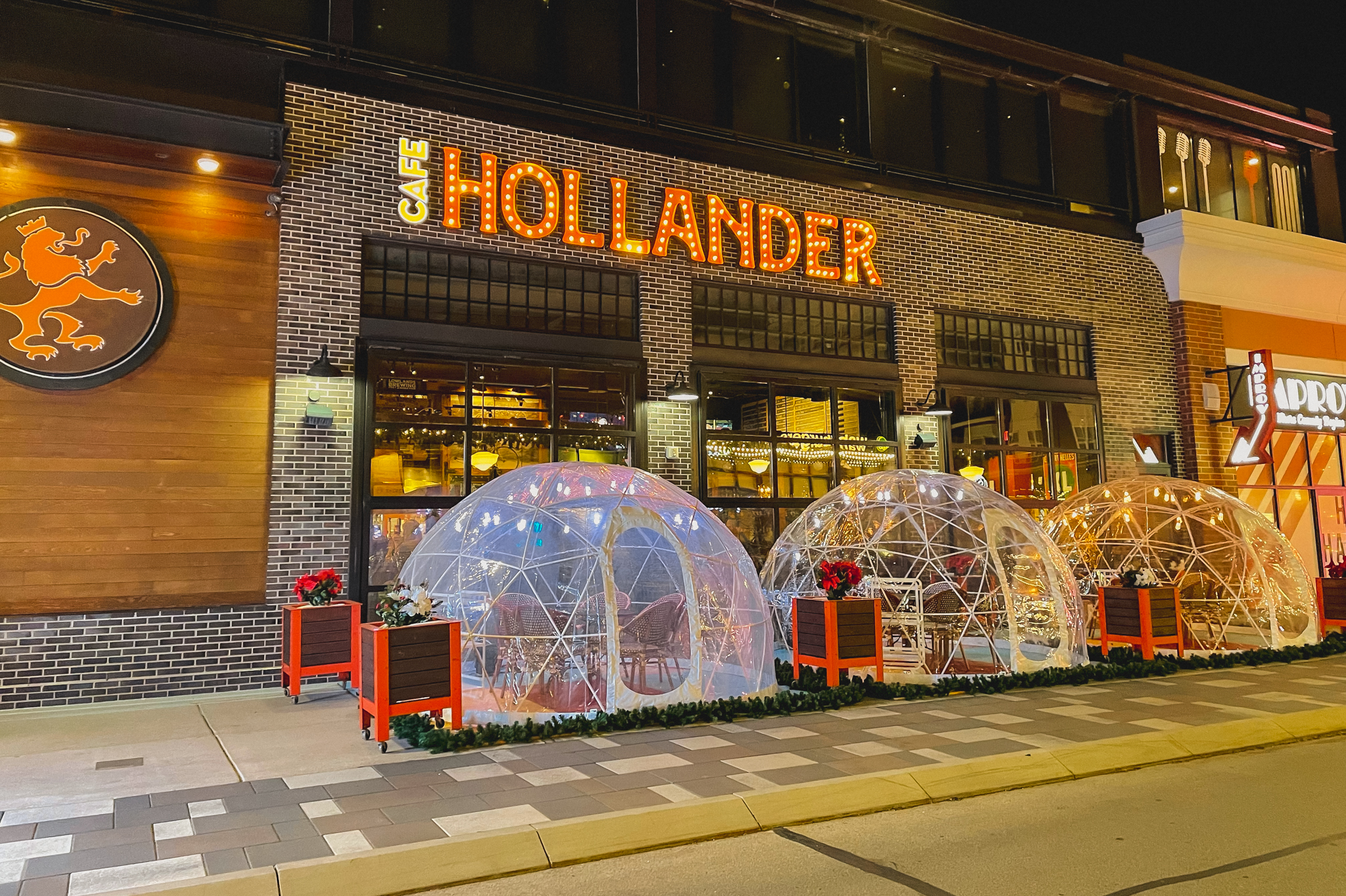 Café Hollander Brookfield's outdoor dining domes lit up with festive colors