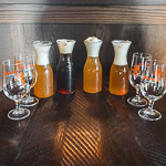 4 tulip-style glasses and 4 carafes of bier